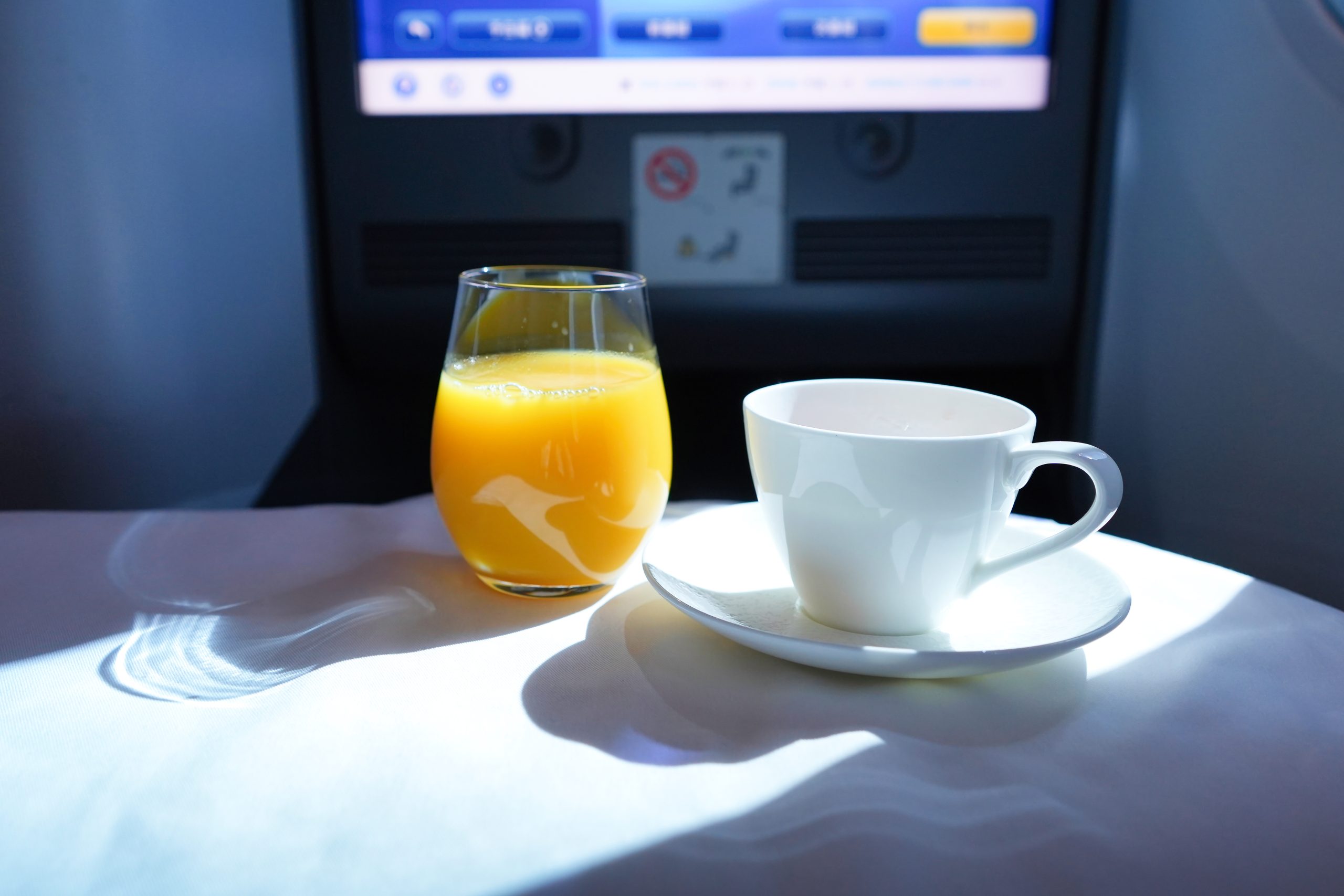 Refreshing orange juice and tea before arrival on ANA Business Class